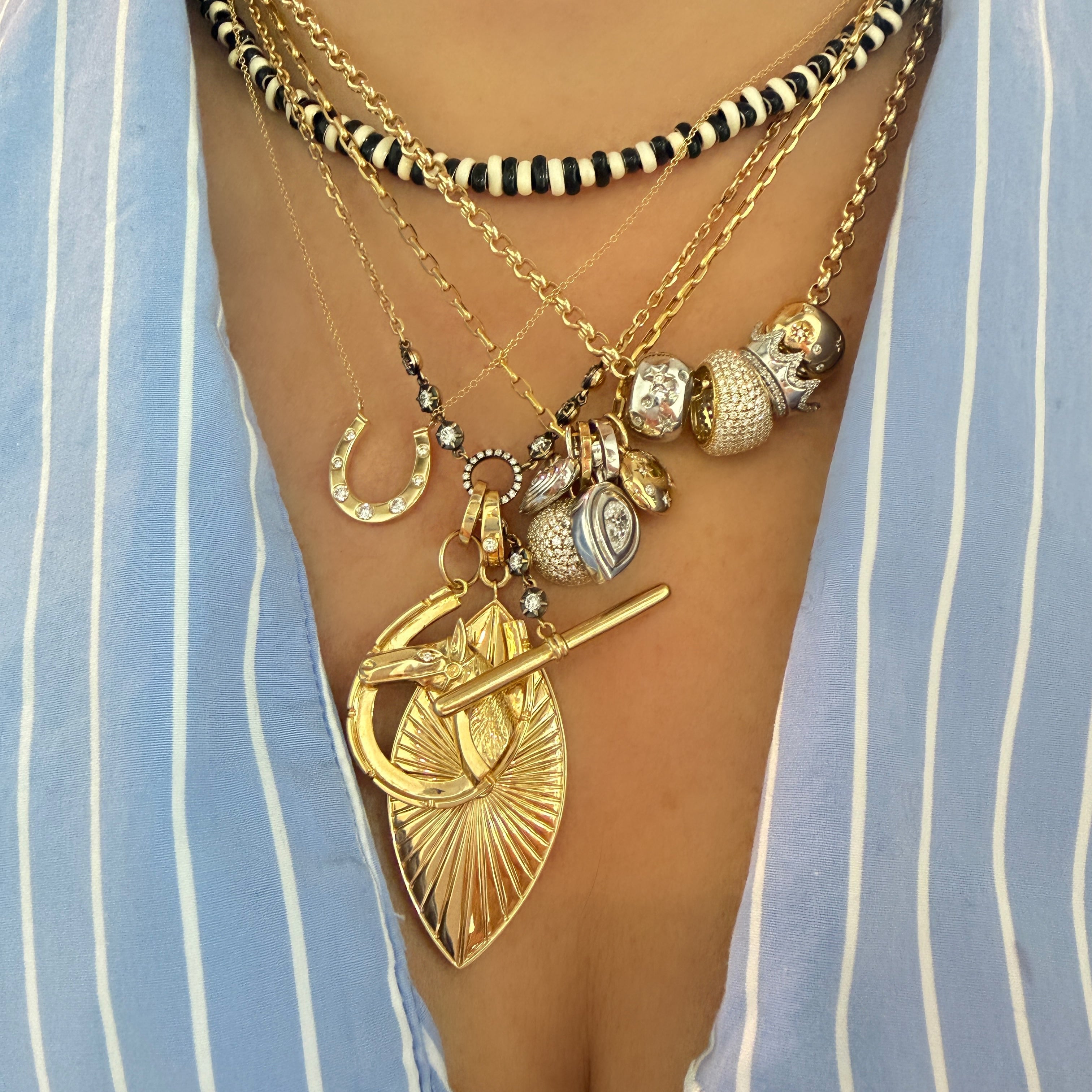 Gold Horseshoe Necklace with Graduated Diamond Details